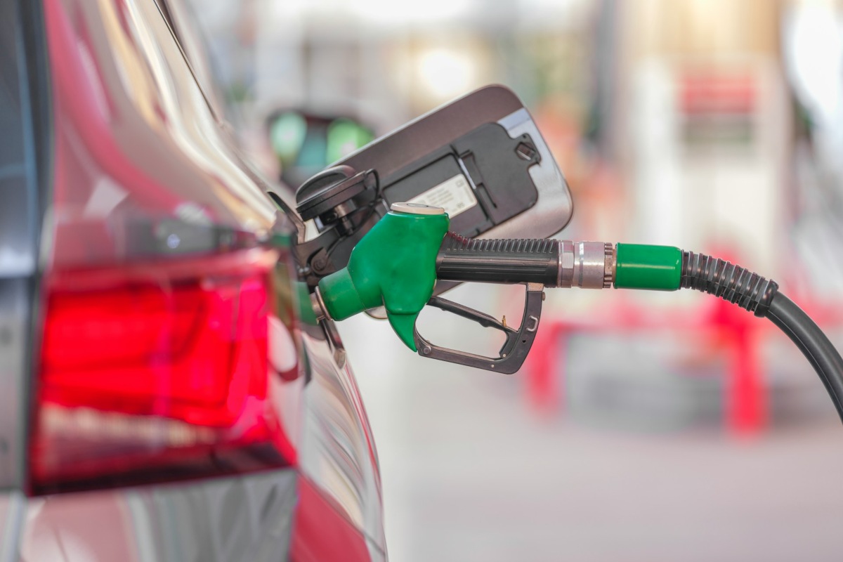 green petrol pump in a car