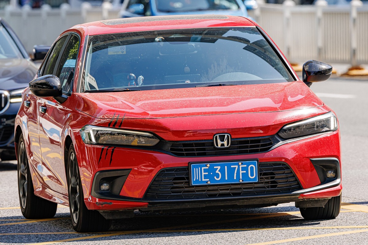 Red Honda Civic on the road